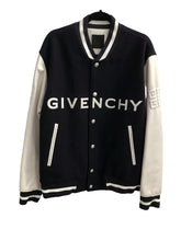 Black and white Givenchy jacket on a hanger with a white background